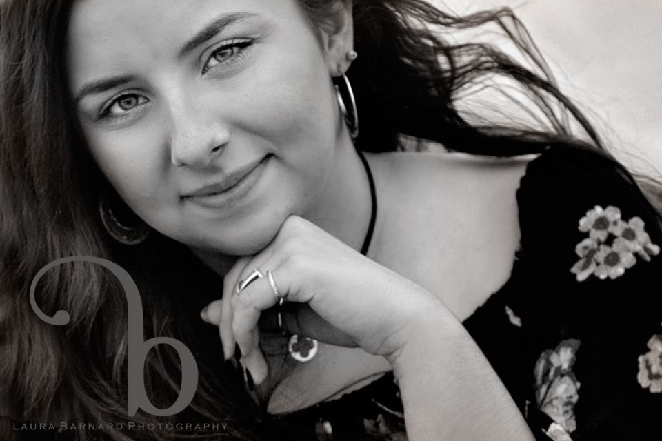 A close senior portrait, black and white.